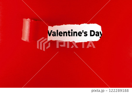 Valentine's Day message on red paper, torn. Valentine's Day concept. 122289188