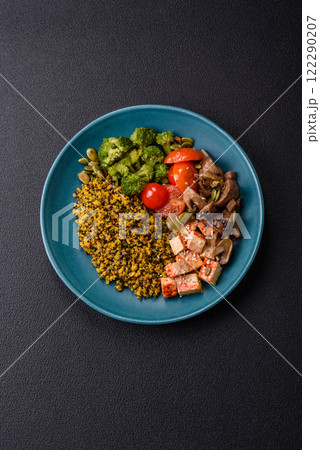 Quinoa bowl with tofu, steamed vegetables, grains, seeds and spices Quinoa bowl with tofu, steamed vegetables, grains, seeds and spices 122290207