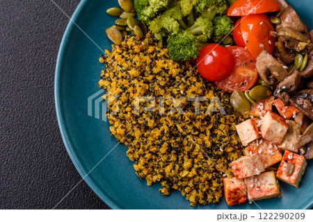 Quinoa bowl with tofu, steamed vegetables, grains, seeds and spices 122290209