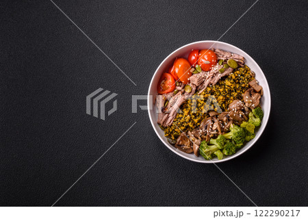 Quinoa bowl with tofu, steamed vegetables, grains, seeds and spices 122290217