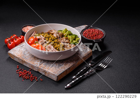 Quinoa bowl with tofu, steamed vegetables, grains, seeds and spices Quinoa bowl with tofu, steamed vegetables, grains, seeds and spices 122290229