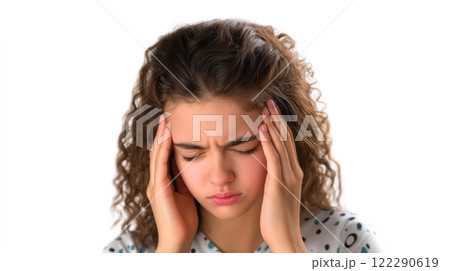A young woman supports her head with her hands, looking like she has a headache, on a white background. Created with Generative AI. 122290619