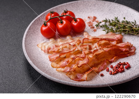 Bacon sliced, grilled with salt and spices Bacon sliced, grilled with salt and spices 122290670