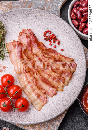 Bacon sliced, grilled with salt and spices Bacon sliced, grilled with salt and spices 122290675