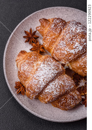 Fresh crispy sweet croissant with chocolate filling Fresh crispy sweet croissant with chocolate filling 122290923