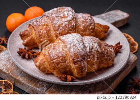 Fresh crispy sweet croissant with chocolate filling Fresh crispy sweet croissant with chocolate filling 122290924
