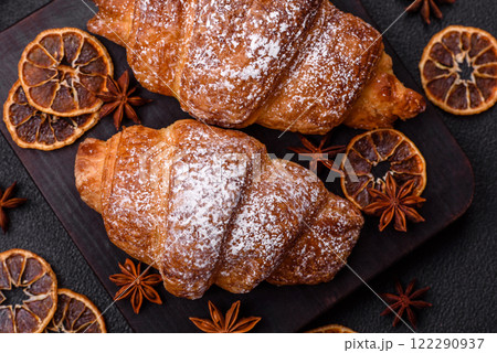 Fresh crispy sweet croissant with chocolate filling Fresh crispy sweet croissant with chocolate filling 122290937