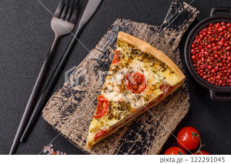 Delicious crispy quiche cut into slices with cheese, broccoli, tomatoes Delicious crispy quiche cut into slices with cheese, broccoli, tomatoes 122291045