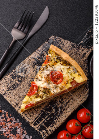 Delicious crispy quiche cut into slices with cheese, broccoli, tomatoes Delicious crispy quiche cut into slices with cheese, broccoli, tomatoes 122291046