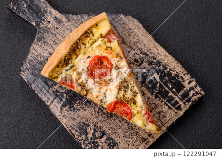 Delicious crispy quiche cut into slices with cheese, broccoli, tomatoes Delicious crispy quiche cut into slices with cheese, broccoli, tomatoes 122291047