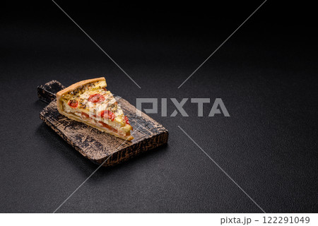 Delicious crispy quiche cut into slices with cheese, broccoli, tomatoes Delicious crispy quiche cut into slices with cheese, broccoli, tomatoes 122291049