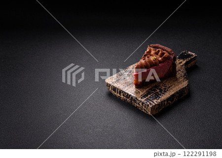 A piece of sweet cheesecake with mascarpone cheese, strawberry flavor A piece of sweet cheesecake with mascarpone cheese, strawberry flavor 122291198
