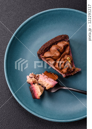 A piece of sweet cheesecake with mascarpone cheese, strawberry flavor A piece of sweet cheesecake with mascarpone cheese, strawberry flavor 122291217