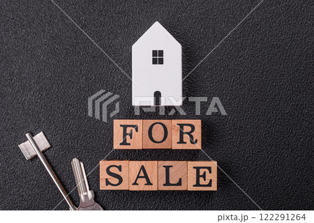 The inscription for sale laid out with wooden cubes 122291264