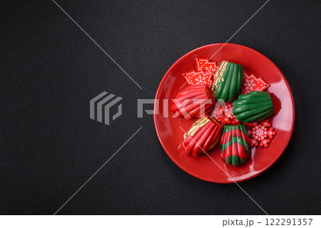 Sweet Madeleines desserts covered with chocolate in Christmas colors 122291357
