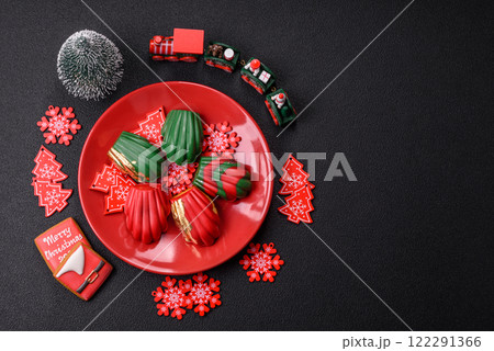 Sweet Madeleines desserts covered with chocolate in Christmas colors 122291366