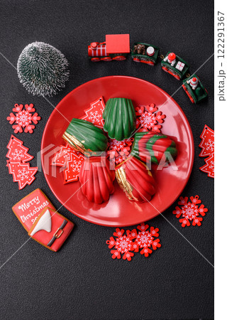 Sweet Madeleines desserts covered with chocolate in Christmas colors 122291367