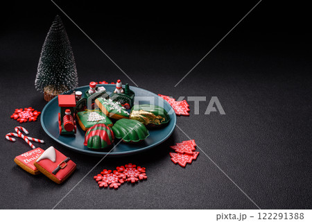 Sweet Madeleines desserts covered with chocolate in Christmas colors Sweet Madeleines desserts covered with chocolate in Christmas colors 122291388
