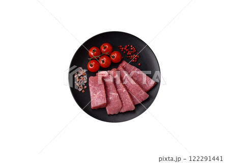 Juicy beef cut into slices with salt, spices and herbs 122291441