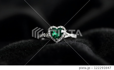 Emerald Heart Ring on Dark Velvet Surface Emerald Heart Ring on Dark Velvet Surface 122291647