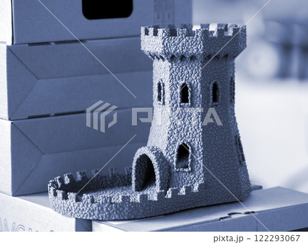 Creative object printed on 3D printer. Three-dimensional model of tower created on 3D printer. 3D model printed on 3D printer from molten plastic. Printing FDM technology. Additive technologies 122293067