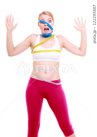 Obsessed fitness woman with a lot of colorful measure tapes 122293887