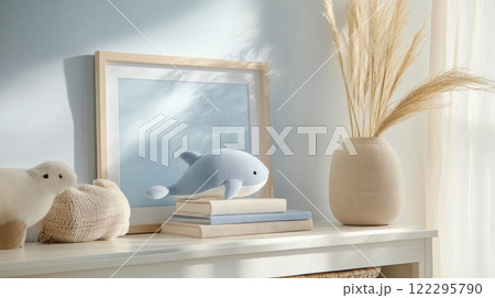 Cozy living space with decorative soft toys and pampas grass vase 122295790