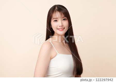 Beautiful young asian woman with clean fresh skin on beige background, Face care, Facial treatment, Cosmetology, beauty and spa, Asian women portrait. Beautiful young asian woman with clean fresh skin on beige background, Face care, Facial treatment, Cosmetology, beauty and spa, Asian women portrait. 122297942