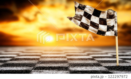 Checkered flag waving at sunset marking the finish line of a race track event Checkered flag waving at sunset marking the finish line of a race track event 122297972
