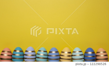 Easter eggs on yellow background 122298526