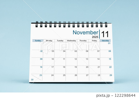 November 2025 Monthly desk calendar for 2025 year on soft blue background. 122298644