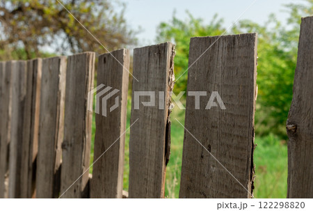 Wooden fence close-up on a sunny summer day 122298820