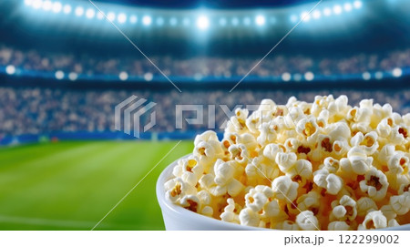 Bucket of Popcorn Spilling at Football Game 122299002