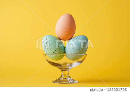 abstract composition colorful easter eggs in bowl on yellow background 122301798
