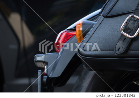 Close-up of shiny chrome motorcycle exhaust pipes with a reflective surface, showcasing industrial design and automotive craftsmanship. Close-up of shiny chrome motorcycle exhaust pipes with a reflective surface, showcasing industrial design and automotive craftsmanship. 122301842