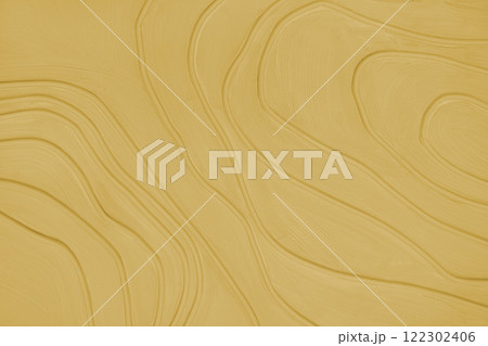Plaster wall with volumetric relief surface with convex wavy lines, yellow gypsum texture panel. Plaster wall with volumetric relief surface with convex wavy lines, yellow gypsum texture panel. 122302406