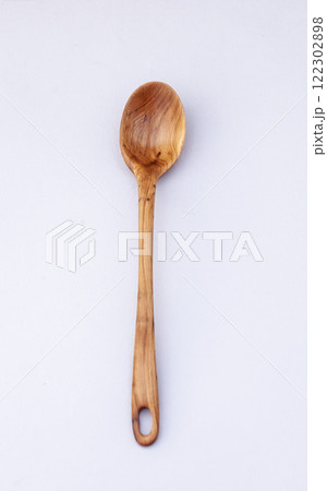 Wooden kitchen utensils stacked view close up isolated Wooden kitchen utensils stacked view close up isolated 122302898
