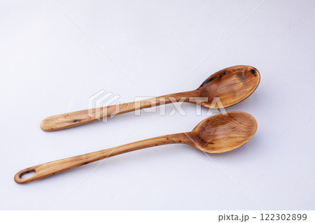 Wooden kitchen utensils stacked view close up isolated Wooden kitchen utensils stacked view close up isolated 122302899