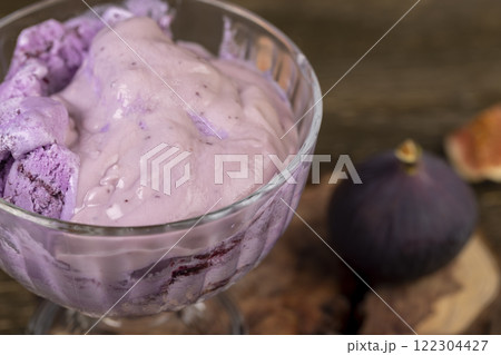 cold sweet fig flavored ice cream and ripe purple figs on the table cold sweet fig flavored ice cream and ripe purple figs on the table 122304427