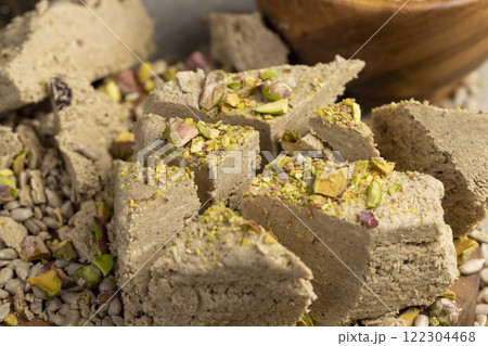 halva made from roasted sunflower seeds and crushed into one solid mass halva made from roasted sunflower seeds and crushed into one solid mass 122304468