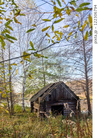 Old, Crumbling Russian Bathhouse in Autumn Landscape Old, Crumbling Russian Bathhouse in Autumn Landscape 122306794