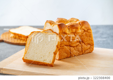 Sliced white bread on wooden board. 122308400