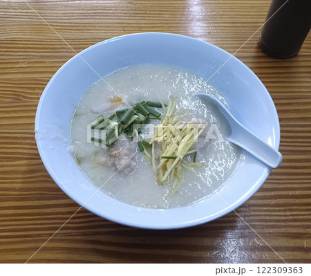 a bowl of rice porridge on table a bowl of rice porridge on table 122309363
