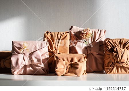 Gifts wrapped in sustainable fabric. Gifts wrapped in sustainable fabric. 122314717