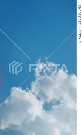 Blue Sky With Beautiful Natural White Clouds. Panorama Blue Sky With Cloud And Sunshine Background. Vertical Time Lapse. 122316343