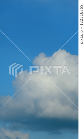 Natural Sky Beautiful Blue And White Texture Background. Clear Blue Sky And White Clouds. Vertical Time Lapse. 122316365
