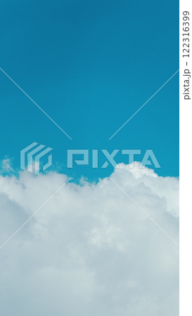 Soft White Cumulus Clouds Move In Blue Sky. Beautiful Nature. Natural Background. Vertical Time Lapse. Soft White Cumulus Clouds Move In Blue Sky. Beautiful Nature. Natural Background. Vertical Time Lapse. 122316399