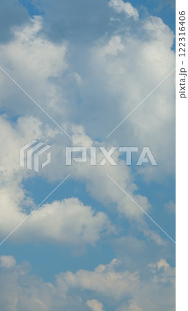 Beautiful Blue Sky And Clouds With Daylight Natural Background. Environment Day With Horizon Skyline View Spring Wind. Vertical Time Lapse. 122316406
