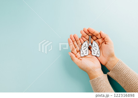 Lungs paper held by two hands represents World TB Day. Raising awareness about tuberculosis, 122316898