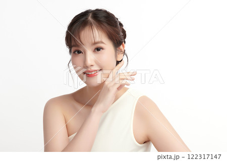 Beautiful young asian woman with clean fresh skin on white background, Face care, Facial treatment, Cosmetology, beauty and spa, Asian women portrait. Beautiful young asian woman with clean fresh skin on white background, Face care, Facial treatment, Cosmetology, beauty and spa, Asian women portrait. 122317147